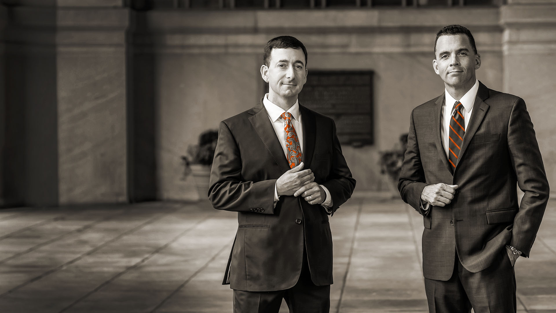 Two lawyers standing in front of building