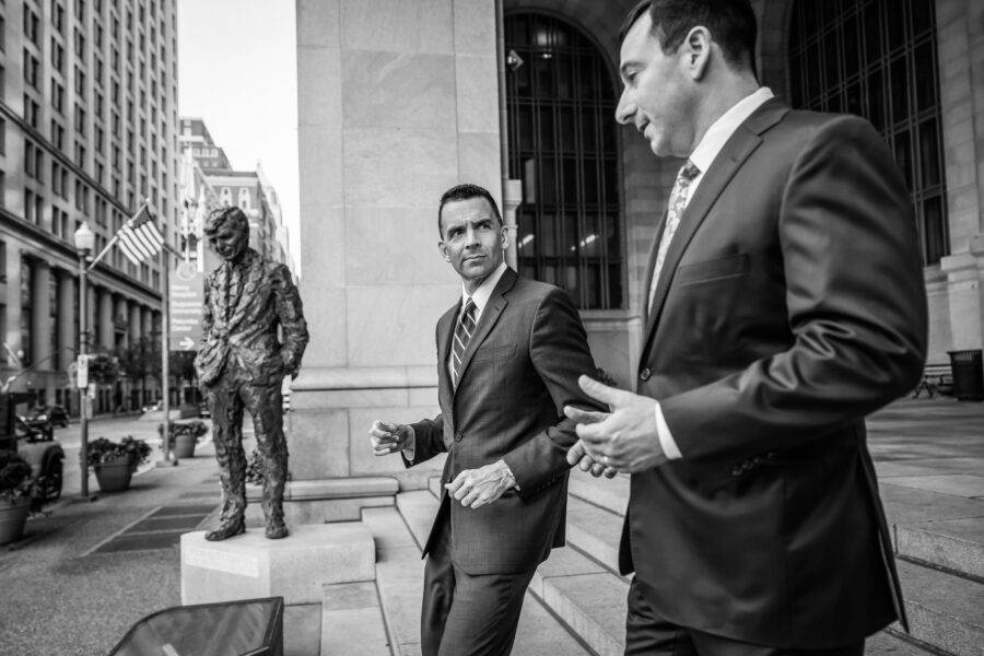 Brendan Lupatin and Greg Unatin walking down stairs